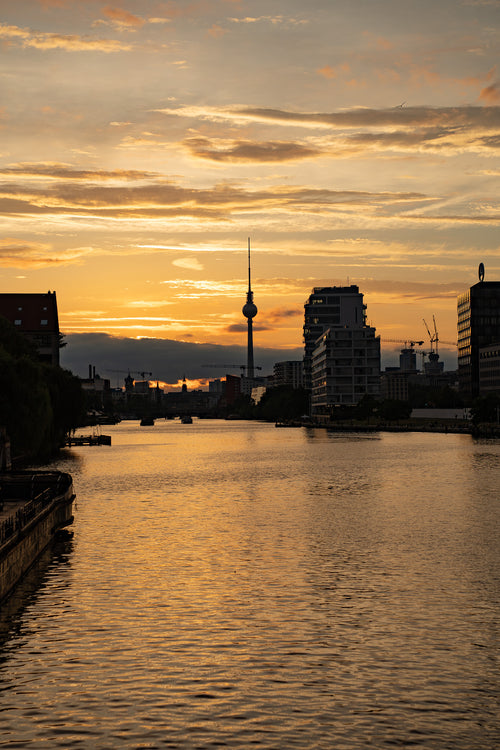 Fernsehturm at golden hour reflected in the Spree, Berlin